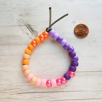 Beach Bracelet, sunset bracelet, ombre bead bracelet, large roller bead, crow bead bracelet, faux glass beads chunky bead purple pink orange - Constant Baubling