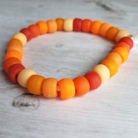 Orange Bead Bracelet, large bead bracelet, orange bracelet, tie on cord, cord bracelet, orange rollers, burnt orange ombre beads, big chunky - Constant Baubling