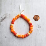 Orange Bead Bracelet, large bead bracelet, orange bracelet, tie on cord, cord bracelet, orange rollers, burnt orange ombre beads, big chunky - Constant Baubling