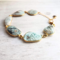 Blue Stone Bracelet - genuine Larimar gemstones in 14k gold plate bezel frame & adjustable chain - sky powder baby blue oblong facet cut - Constant Baubling