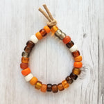 Autumn Bracelet - orange, tan, brown glass big bead tie on faux suede cord, chunky glass pony roller beads, VSCO girl, fall color jewelry - Constant Baubling