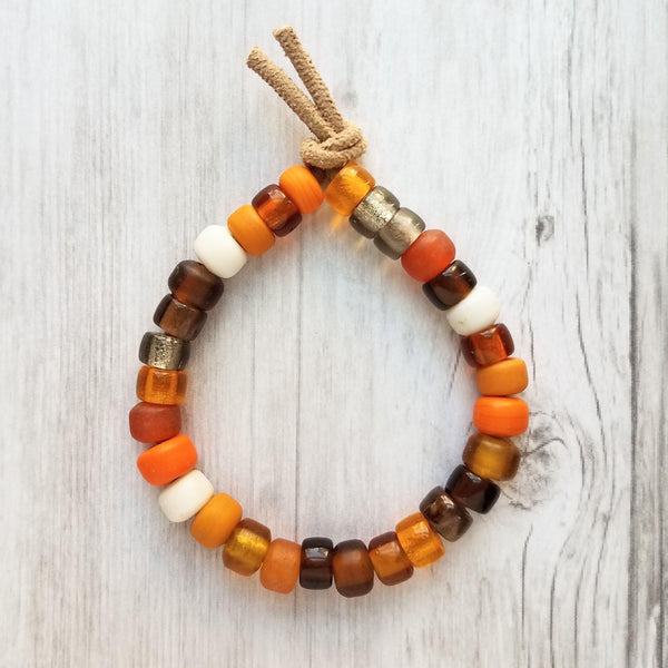 Autumn Bracelet - orange, tan, brown glass big bead tie on faux suede cord, chunky glass pony roller beads, VSCO girl, fall color jewelry - Constant Baubling