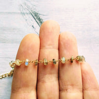 Labradorite Bracelet, tiny grey stone, semi precious gemstone, adjustable gold chain, vitreous iridescent blue green flash, spiritual symbol - Constant Baubling