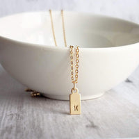 Gold Tag & Initial, 14 karat gold fill tag, gold tag necklace, gold fill chain, small hand stamped letter, small gold tag tiny rectangle tag - Constant Baubling