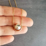 Eclipse Necklace, silver hematite stone ball, gold half circle pendant, mixed metal necklace, lunar eclipse jewelry, spinning ball bead moon - Constant Baubling