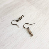 Seahorse Earrings - little tiny black gunmetal silver charms dangle on small simple shiny delicate hooks, minimalist tropical beach memento - Constant Baubling