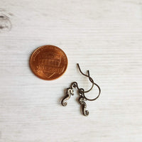 Seahorse Earrings - little tiny black gunmetal silver charms dangle on small simple shiny delicate hooks, minimalist tropical beach memento - Constant Baubling