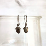 Mini Acorn Earrings - small black silver gunmetal squirrel nut charms dangle on delicate shiny little ear hooks, fall autumn jewelry - Constant Baubling