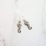 Tiny Seahorse Earrings - little antique silver silver charms dangle on small simple shiny delicate hooks, tropical beach vacation memento - Constant Baubling