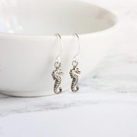 Tiny Seahorse Earrings - little antique silver silver charms dangle on small simple shiny delicate hooks, tropical beach vacation memento - Constant Baubling