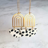 Large Leopard Print Earrings - gold brass rainbow arches w/ black white pony cow spots, long latching kidney ear hooks, 3 inch, cork leather - Constant Baubling