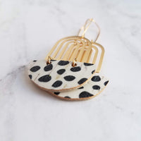 Large Leopard Print Earrings - gold brass rainbow arches w/ black white pony cow spots, long latching kidney ear hooks, 3 inch, cork leather - Constant Baubling