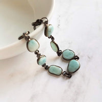 Blue Larimar Bracelet w/ shiny black gunmetal bezel frames, small organically shaped oval gemstones, aqua genuine stone adjustable chain - Constant Baubling