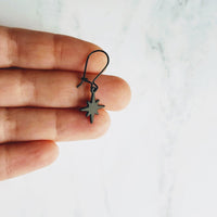 Black Star Earrings, small matte black sunburst charm, latching kidney hooks, night earrings, celestial earring starburst earring north star - Constant Baubling