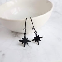 Black Star Earrings, small matte black sunburst charm, latching kidney hooks, night earrings, celestial earring starburst earring north star - Constant Baubling