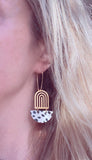 Large Leopard Print Earrings - gold brass rainbow arches w/ black white pony cow spots, long latching kidney ear hooks, 3 inch, cork leather - Constant Baubling