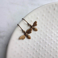 Little Bee Earrings, small antique brass bee earring, bumblebee earring, flying bee earring, bronze honey bee earring, bee dangle earring - Constant Baubling