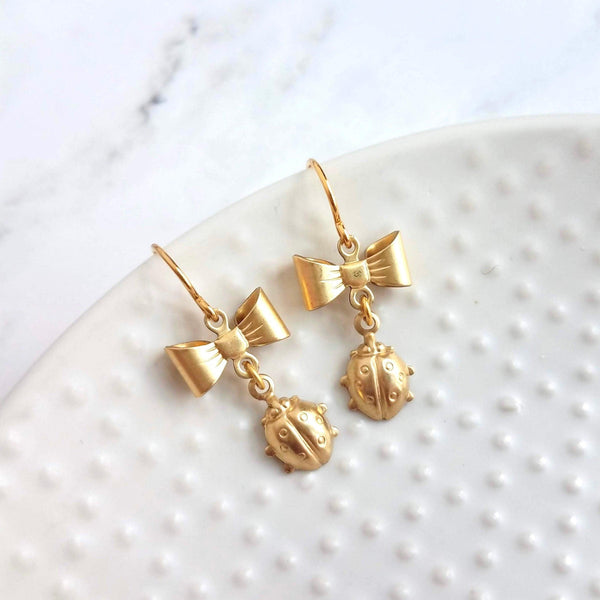 Little Ladybug Earrings, gold bow earring, gold lady bug charm, lady bug earring, gold ladybug earring, small ladybug, ladybug dangle insect - Constant Baubling