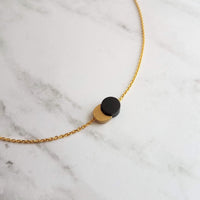 Sun Moon Necklace - solar eclipse pendant on delicate chain, celestial jewelry, moon shadow necklace, black gold crescent jewelry, new moon - Constant Baubling