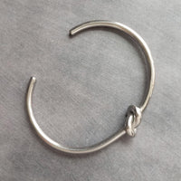 Silver Knot Bracelet - tie the knot bracelet, bridesmaid bracelet, pretzel knot, knot cuff, silver cuff bracelet, thin cuff, oval bangle - Constant Baubling