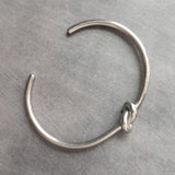 Silver Knot Bracelet - tie the knot bracelet, bridesmaid bracelet, pretzel knot, knot cuff, silver cuff bracelet, thin cuff, oval bangle - Constant Baubling