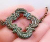 Clover Necklace - green blue verdigris patina on medium antique bronze/brass chain - large lucky 4 leaf lobe pendant w/ ornate detail - Constant Baubling