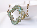 Clover Necklace - green blue verdigris patina on medium antique bronze/brass chain - large lucky 4 leaf lobe pendant w/ ornate detail - Constant Baubling