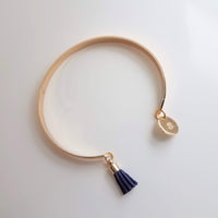 Gold Cuff Bracelet, initial bracelet, gold letter bracelet, gold tassel bracelet, thin gold cuff, navy blue tassel cuff, letter charm bangle - Constant Baubling