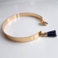 Gold Cuff Bracelet, initial bracelet, gold letter bracelet, gold tassel bracelet, thin gold cuff, navy blue tassel cuff, letter charm bangle - Constant Baubling