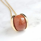 Red Sandstone Necklace, stone ball pendant, sparkling stone necklace, gold chain, brown stone necklace, spinning ball pendant, glitter stone - Constant Baubling