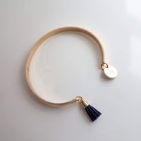 Gold Cuff Bracelet, initial bracelet, gold letter bracelet, gold tassel bracelet, thin gold cuff, navy blue tassel cuff, letter charm bangle - Constant Baubling