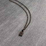 Tiny Padlock Necklace, gunmetal black padlock necklace, black lock necklace, gunmetal lock necklace, small lock pendant, commitment necklace - Constant Baubling