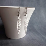 Thin Silver Leaf Earrings, long narrow leaf earrings, filigree leaves earring, long silver leaf earring, cut out leaf earring, huggie hoops - Constant Baubling