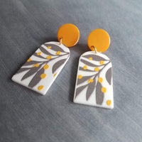 Large Tropical Earrings, big 80s earring, orange stud, chunky acrylic earring, long plastic earring, white grey orange dots, grey palm leaf - Constant Baubling