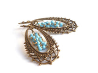 Long Oval Earrings - elongated lacy filigree in antique brass/bronze with tiny blue bead cluster center - fancy decorative boho - Constant Baubling